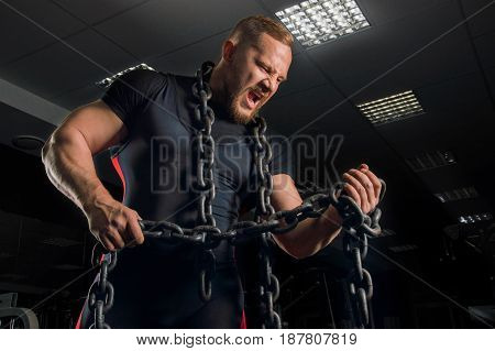 Professional Powerlifter Does A Static Exercise On The Biceps Of The Hand