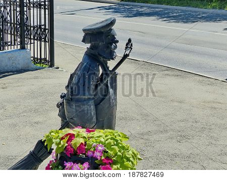 Berezovsky, Russia - May 19, 2017: Monument janitor in the center of Berezovsky. Closeup. Ural