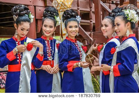 NAKORN PHANOM THAILAND - FEBRUARY 14 2015: Thai northeastern Phutai dancers with traditional costume in Phutai world event day in Renunakorn of Nakorn Phanom Thailand.