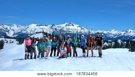 VANCOUVER, BC/CANADA - MAY 22, 2017: Group of friends on the trail to Elfin Lakes near Squamish. Snowshoeing in Sea to Summit.