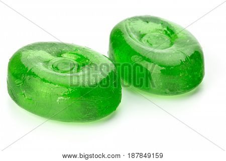 Two colorful fruit hard sugar candies,  boiled sweeties or sugar plums isolated on white background cutout