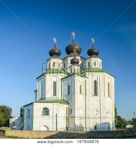 Russian Orthodox church with dark domes on sunny day