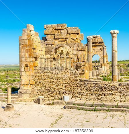VOLUBILIS ,MOROCCO - APRIL 7,2017 - Ruins of Basilica in the ancient Volubilis . Volubilis is a partly excavated Berber and Roman city in Morocco situated near the city of Meknes.