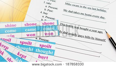 English test on table with pencil and cards