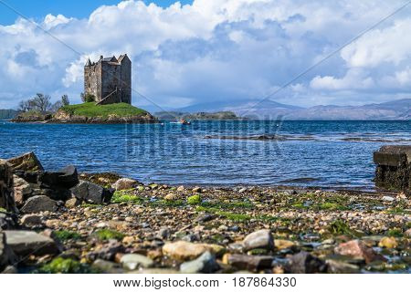View of the Castle Stalker surrounded by water near Port Appin, Argyll, Scotland