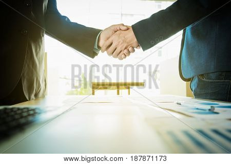 Business partnership meeting concept. Image businessmans handshake. Successful businessmen handshaking after good deal.