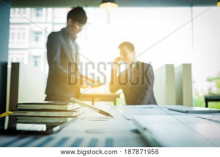 Coworkers team brainstorming process.Startup business people meeting to discuss the project and analysis the information together. Two business argue with partner blurred background.