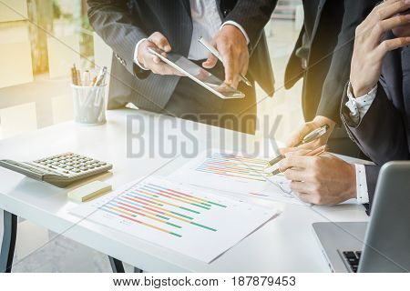 business team looking at report and having a discussion in office. business teamwork concept.