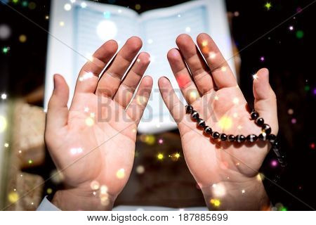 Muslim man praying for god in dark room at ramadan,colorful and vintage tone filter effect color style