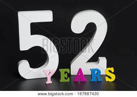 Letters And Numbers-fifty-two On A Black Background.