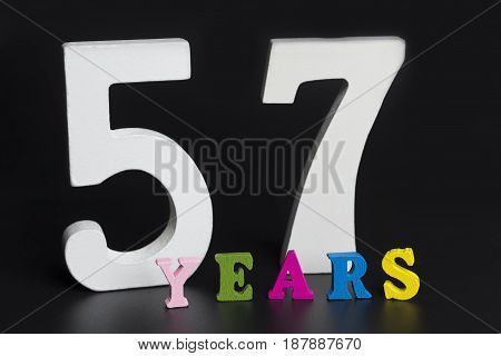 Letters And Numbers-fifty-seven On A Black Background.