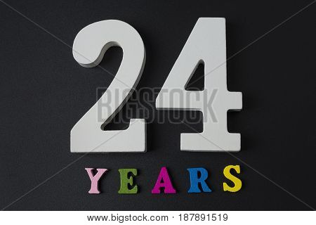Letters And Numbers Twenty-four Years On A Black Background.