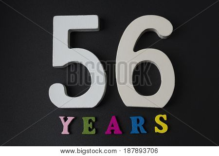 Letters And Numbers-fifty Six On A Black Background.
