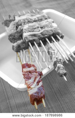 abruzzese mini sheep skewers called arrosticini on white dish