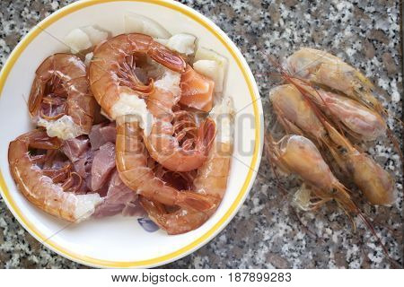 shrimps mixed with variety of cubes of fillet fishes to prepare the Italian pasta al misto mare