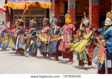 LAMAYURU INDIA - JUNE 13 2015: Unidentified buddhist lamas dressed in mystical mask dancing Tsam mystery dance in time of Yuru Kabgyat Buddhist festival at Lamayuru Gompa Ladakh North India
