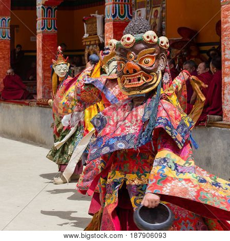 LAMAYURU INDIA - JUNE 13 2015: Unidentified buddhist lamas dressed in mystical mask dancing Tsam mystery dance in time of Yuru Kabgyat Buddhist festival at Lamayuru Gompa Ladakh North India