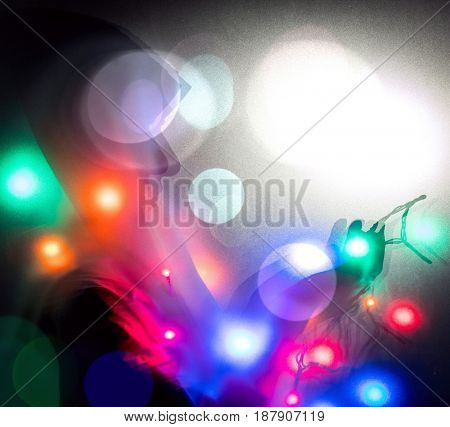 Muslim woman praying in dark room with nice lights around her