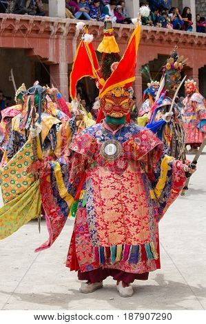 LAMAYURU INDIA - JUNE 13 2015: Unidentified buddhist lamas dressed in mystical mask dancing Tsam mystery dance in time of Yuru Kabgyat Buddhist festival at Lamayuru Gompa Ladakh North India
