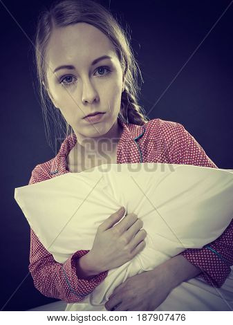 Sad Depressed Girl In Bed Gripping Pillow