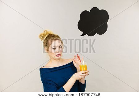Disgusted Woman Holding Orange Juice