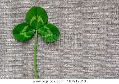 Green Leaves Of Clover On The Background Of Linen Cloth.