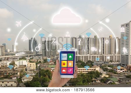 iotInternet of things(business concept)smart citycloud concept.Business man use application in mobile phone and augmented reality technology to control monitor and management the datainformation