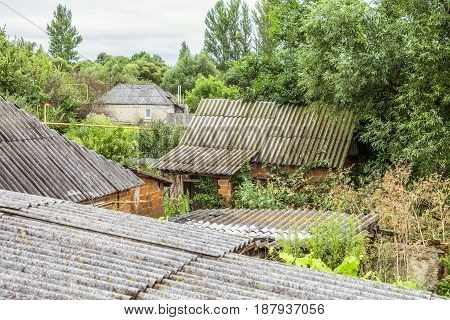 Abandoned old beggar house of an old Russian village. Orphaned slums.