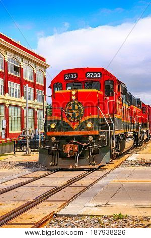 Fargo, ND, USA - 07/24/2015: Orange Loco of the BNSF (Burlington North Santa Fe) railroad in Fargo N.Dakota