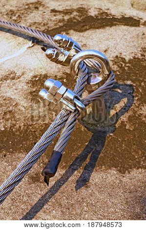 Eay Bolt In The Middle. Steel Anchor Bolt Eye In Rock. The Fixed  Steel Rope. Climbers Path Via Ferr