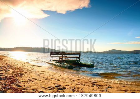 Abandoned Old Rusty Paddle Boat Stuck On Sand Of Beach. Wavy Level, Islad On Horizon. Autumn Weather