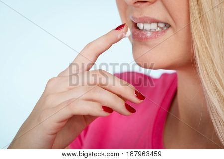 Woman Applies Lip Balm Cream To Her Lips