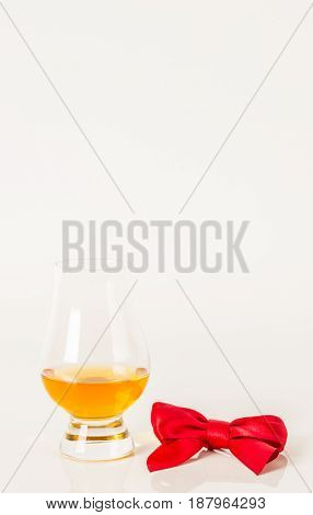 Single Malt Tasting Glass, Single Malt Whisky In A Glass, White Background, Red Bow