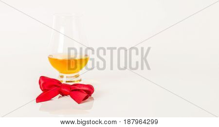Single Malt Tasting Glass, Single Malt Whisky In A Glass, White Background, Red Bow