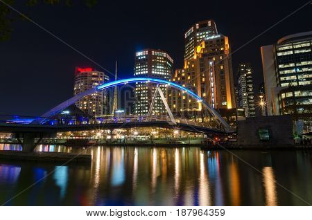 Beautiful Bridge Over River And Cityscape At Night