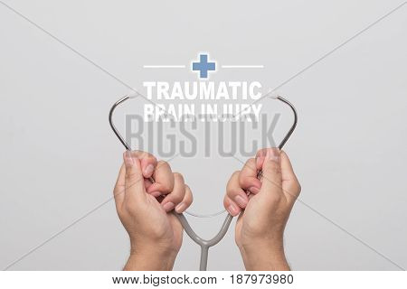 Hands holding a stethoscope and word 