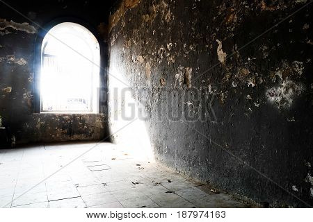 Barred door and windows in abandoned house interior