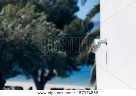 surveillance camera above a beach in hotel resort