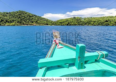 Front of ship nose heading to the island in turquoise sea and blue sky of koh Mak (Mak island) Trat Thailand.