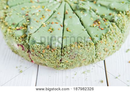 Close up green sliced pistachio cake top view