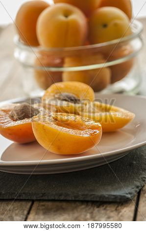 sliced apricots isolated on black background close up
