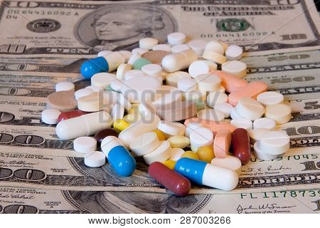 Medicine Pills Or Capsules With Money, Dollar. Medical Or Pharmacy Prescription For Health. Business