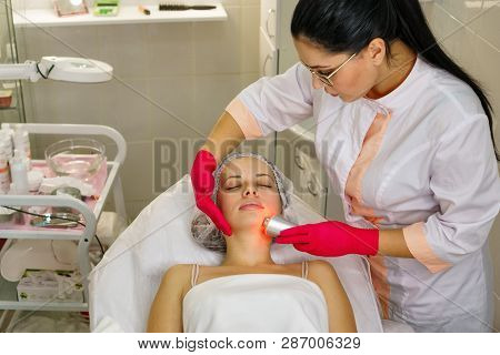Girl In Spa Salon. Cosmetic Procedure For Rejuvenation. Ultrasonic Cleaning And Face Lift. Beauticia