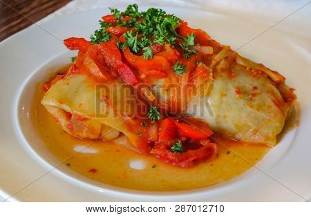 Traditional Russian Cabbage Rolls, Stuffed With Ground Beef Cooked In Tomato Sauce And Served On A P
