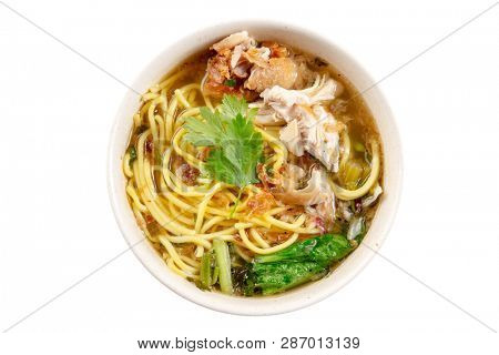 Asian soup noodles and chicken in bowl. Top view flat lay isolated on white background.