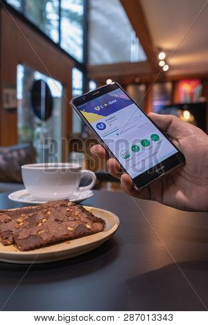 Chiang Mai, Thailand - May 09,2018: Man Holding Huawei With Dropbox On Screen. Dropbox Is A Service 