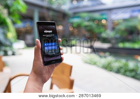 Chiang Mai, Thailand - May 05,2018: Man Holding Huawei With Vimeo On Screen.  Vimeo Is A Video-shari
