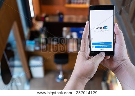 Chiang Mai, Thailand - April 21,2018: Man Holding Huawei Mobile Phone With Linkedin Application On T