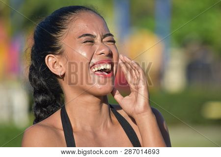 An Adult Female Laughing