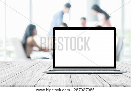 Laptop Blank Mock Up Screen Placed On White Wooden Table On Blurred People Meeting In Coffee Shop Ca
